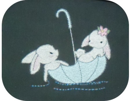 Motif de broderie machine lapins dans un parapluie