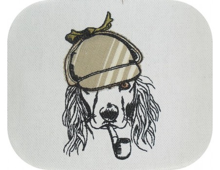 Motif de broderie machine cocker avec sa casquette appliquée et sa pipe