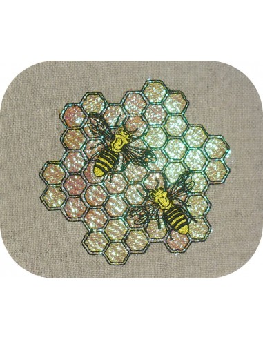 Motif de broderie machine les  abeilles sur une alvéole en mylar