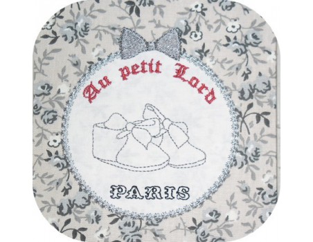 Motif de broderie  chaussons de bébé dans cadre