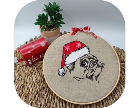 machine embroidery  design dog carlin with a christmas cap