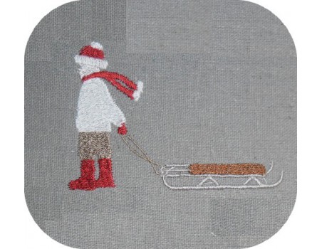 Motif de broderie machine enfant tirant sa luge